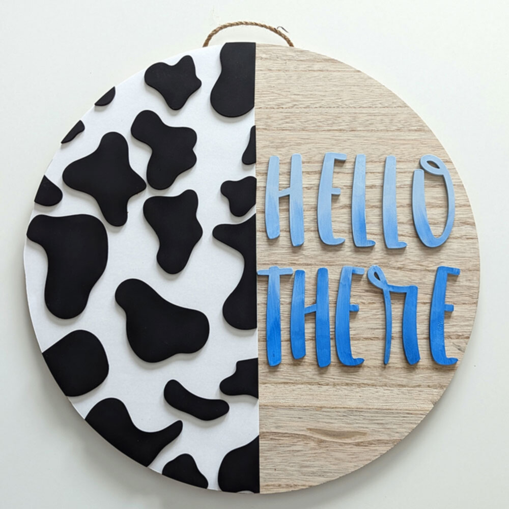 Hello there cow welcome sign