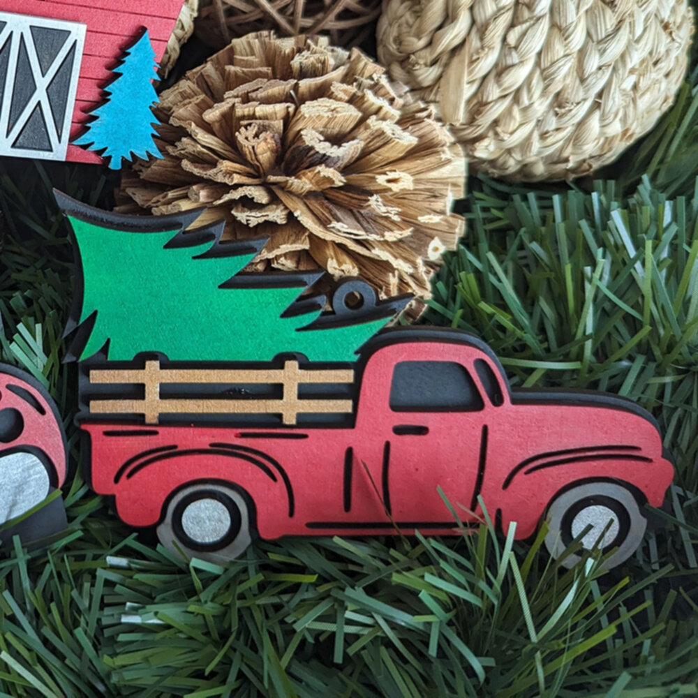 image of a red truck with christmas tree ornament