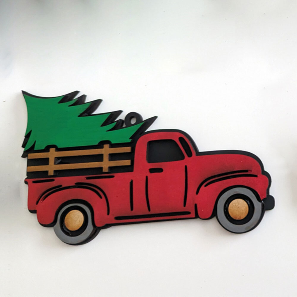 image of a red truck with christmas tree ornament