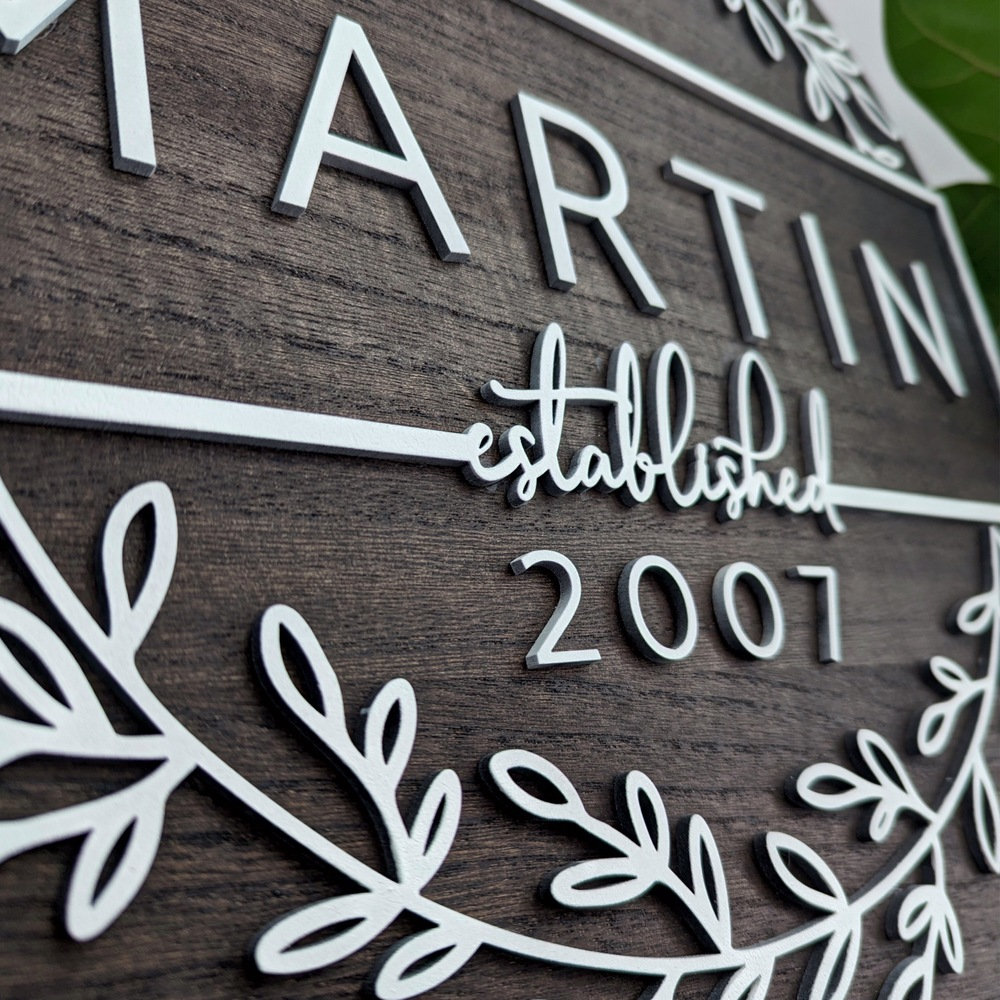 A modern farmhouse styled sign with the words Martin, established 2007