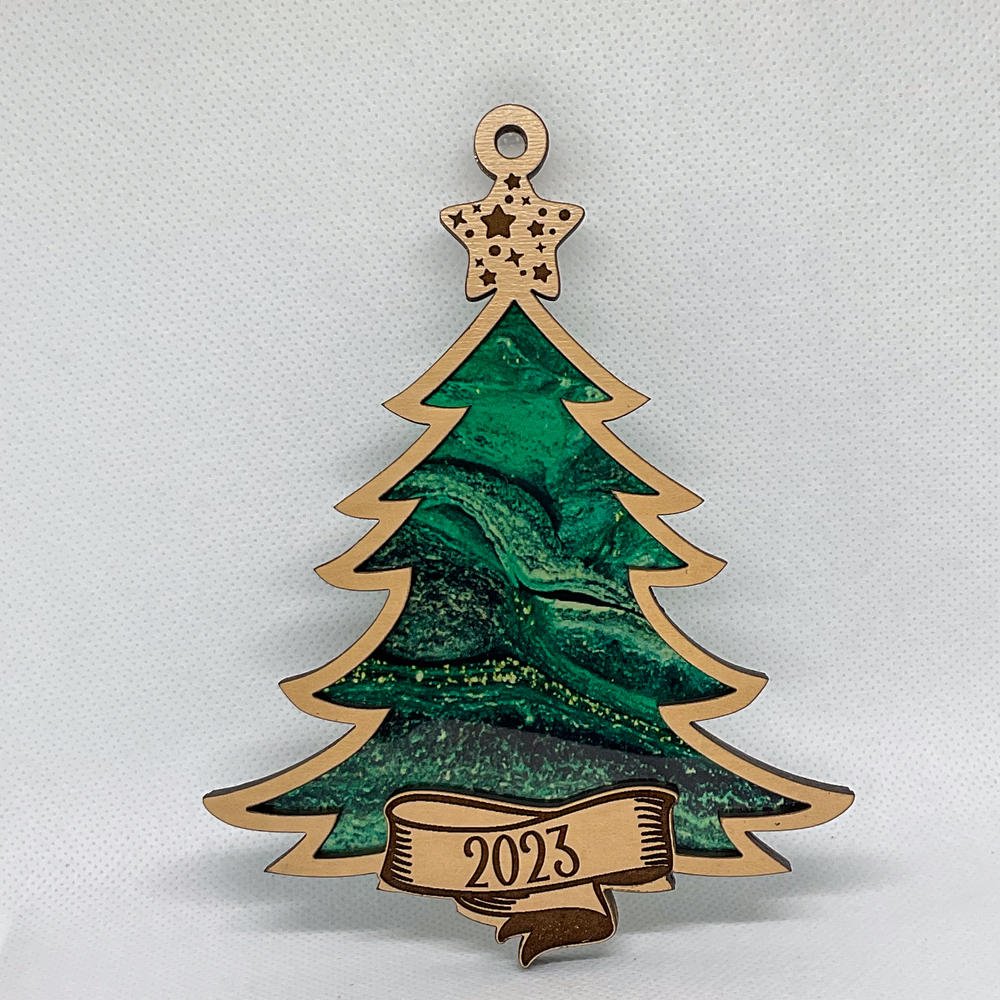 A Christmas tree ornament with a colorful inlay.