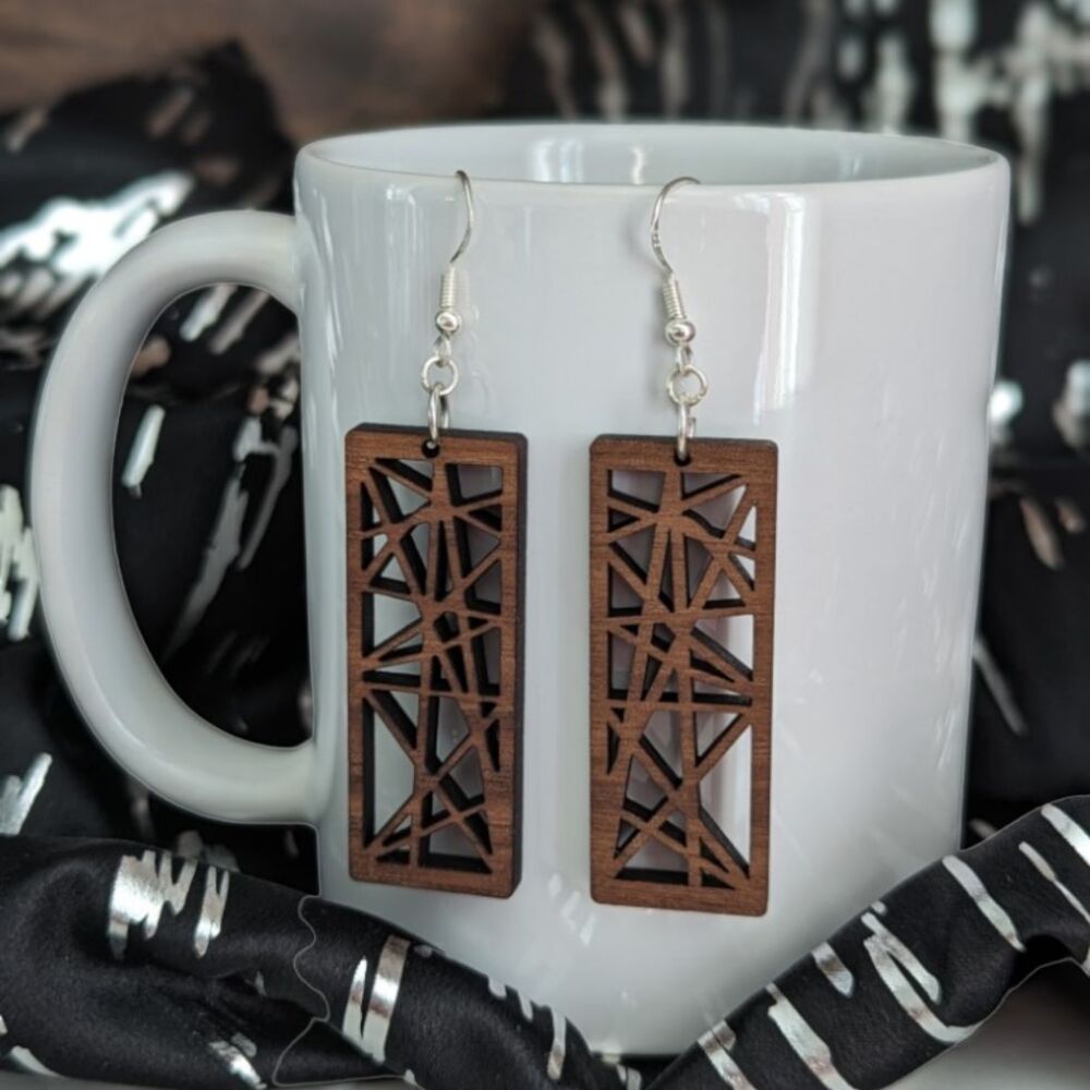 Rectangular earrings cut from a cherry wood with a contemporary design