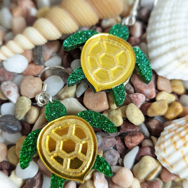 Glittering green and metallic gold sea turle earring