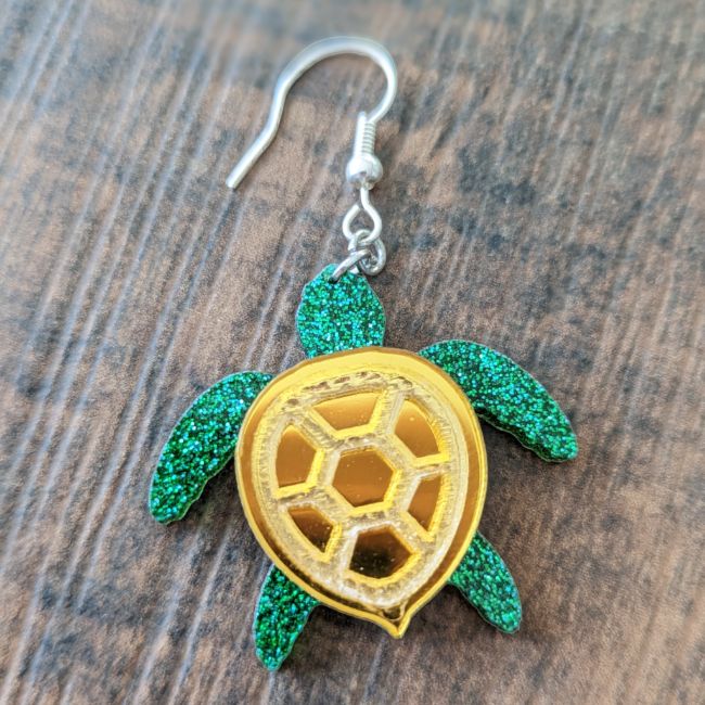 Glittering green and metallic gold sea turle earring