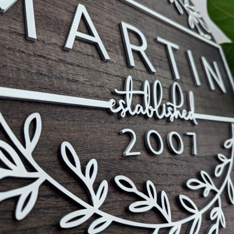 A modern farmhouse styled sign with the words Martin, established 2007