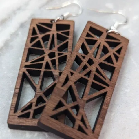 Rectangular earrings cut from a cherry wood with a contemporary design