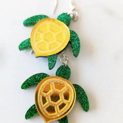 Glittering green and metallic gold sea turle earring