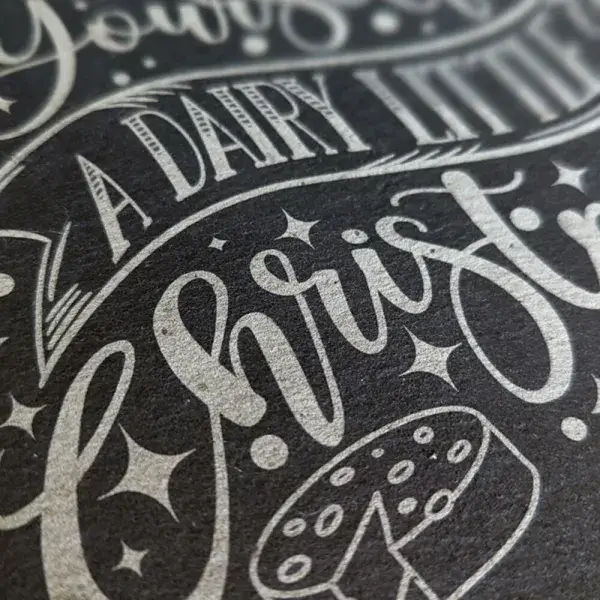 Have yourself a dairy little Christmas engraved on slate closed up.